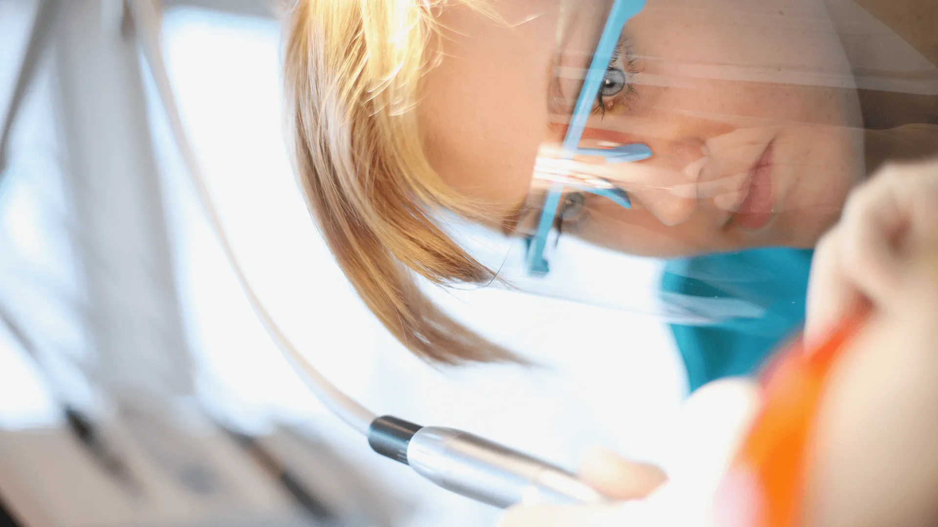 A dentist performing a dental procedure