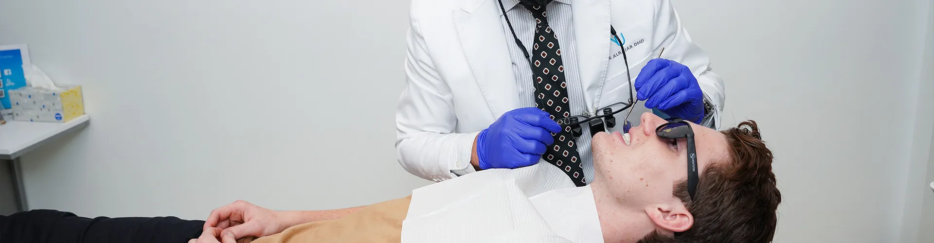 A man being examined by a dentist.