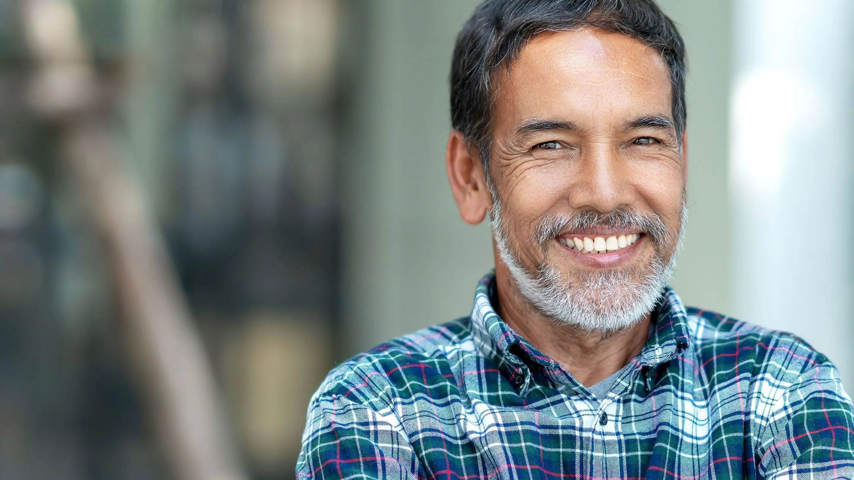 An image of an elderly man smiling
